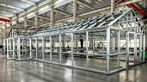 Full view of the large L15W6H4m gable roof greenhouse steel skeleton pre-assembled on the factory floor.
